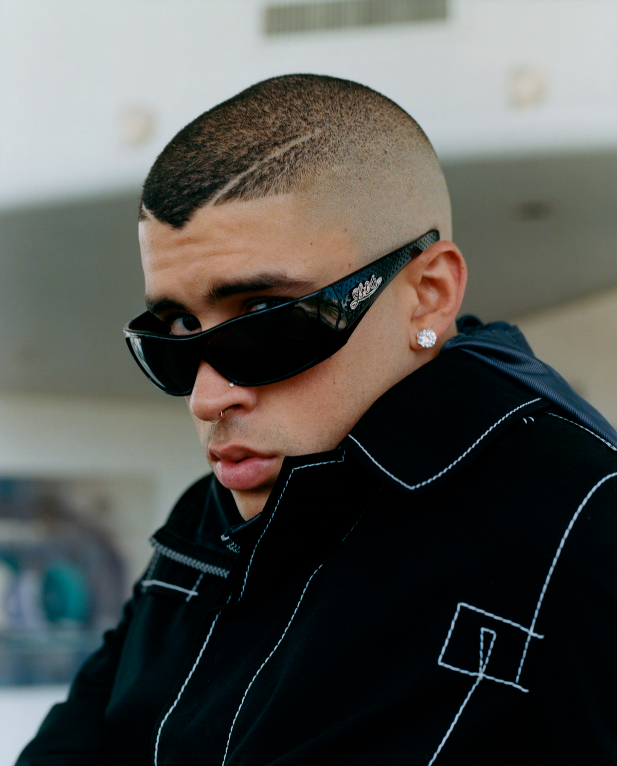 Bad Bunny talks with his friend, Spanish singer Rosalía, about acrylic nail...