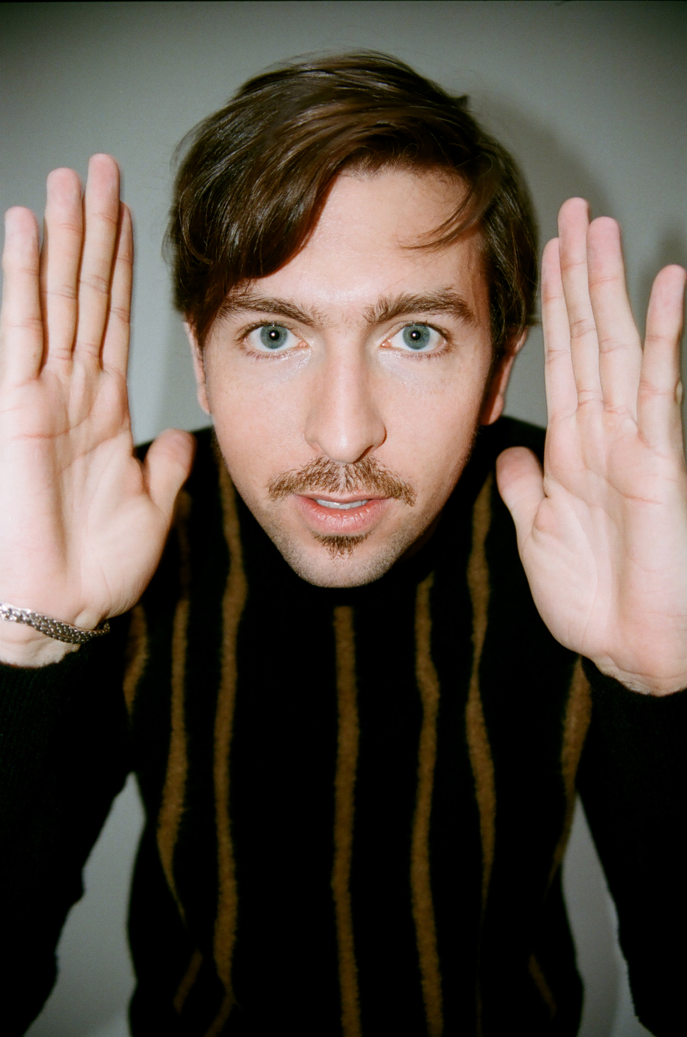 "Succession" Star Nicholas Braun Tries On Some Sweaters