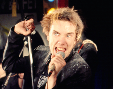 Johnny Rotten with mic at Christmas Gig