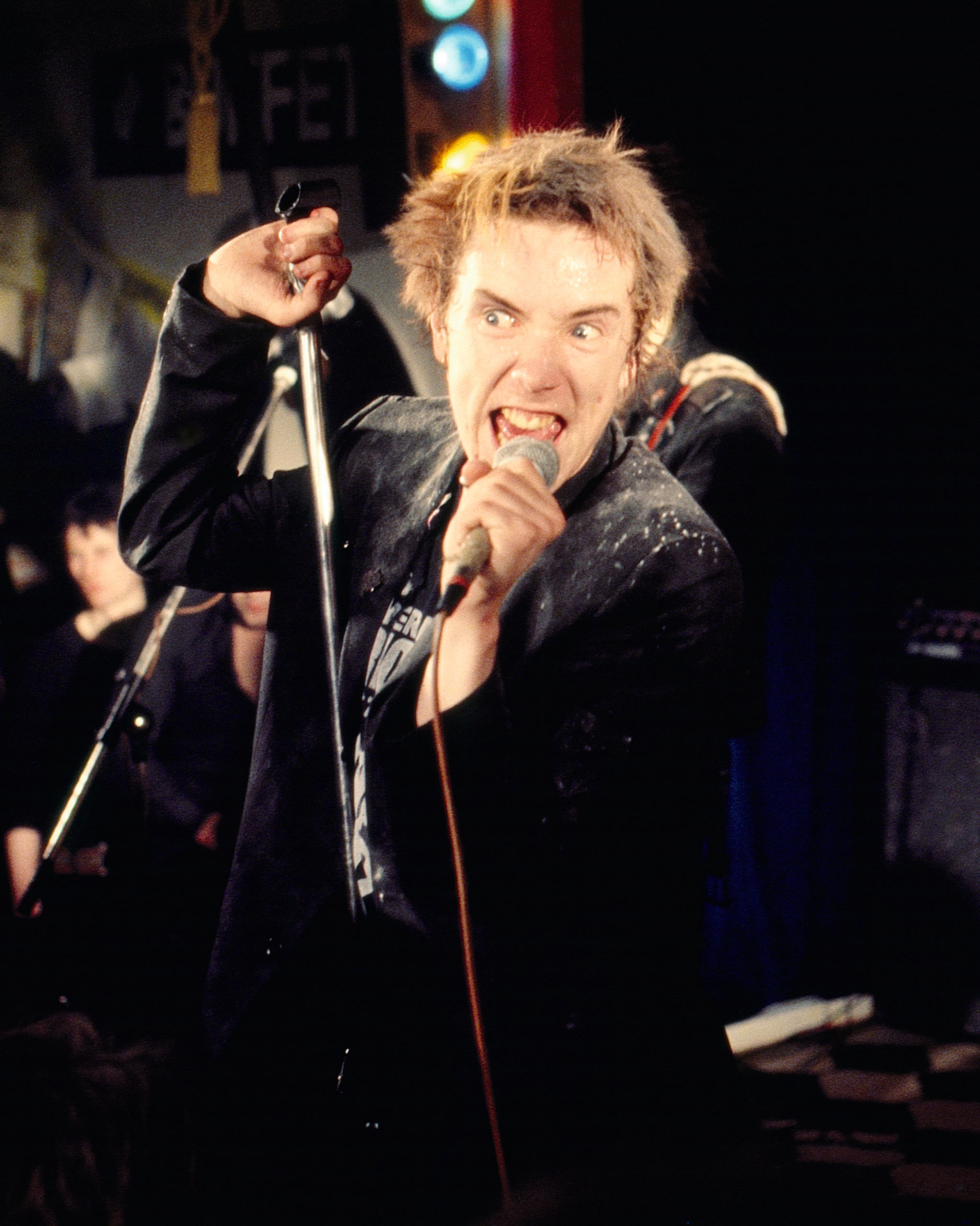 Johnny Rotten with mic at Christmas Gig