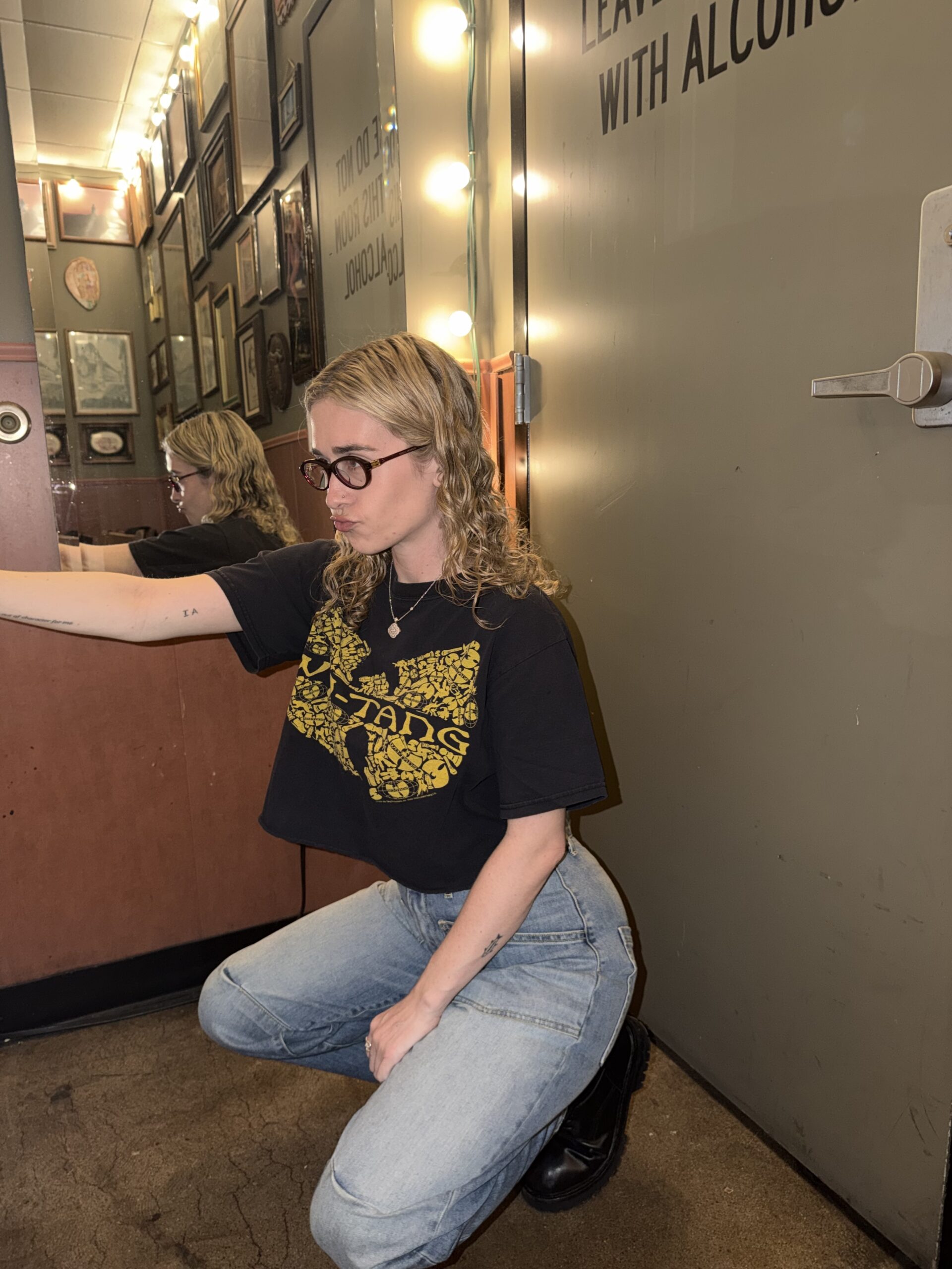 Blondshell squatting and posing.