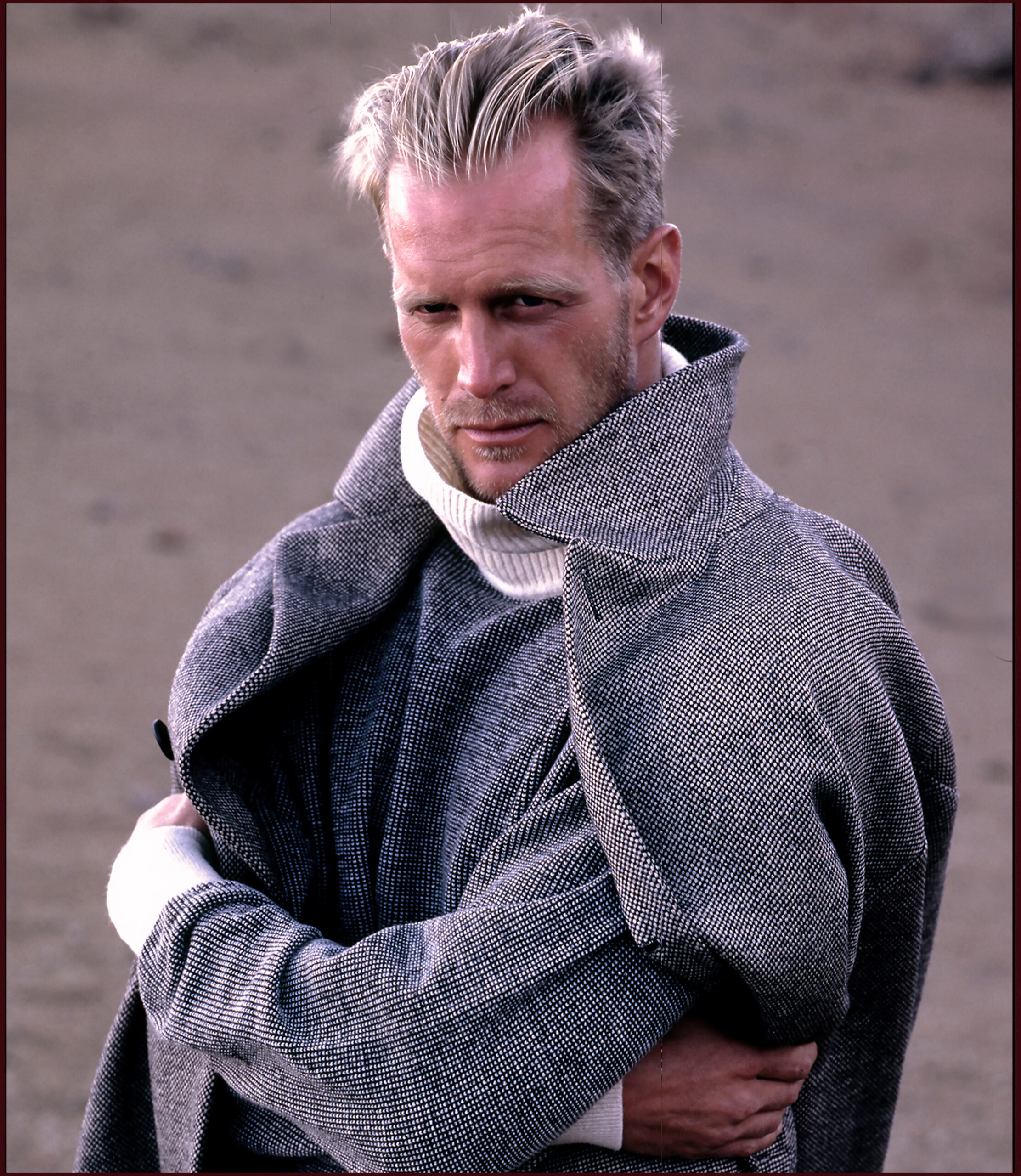 Hoyt Richards in a coat on the beach