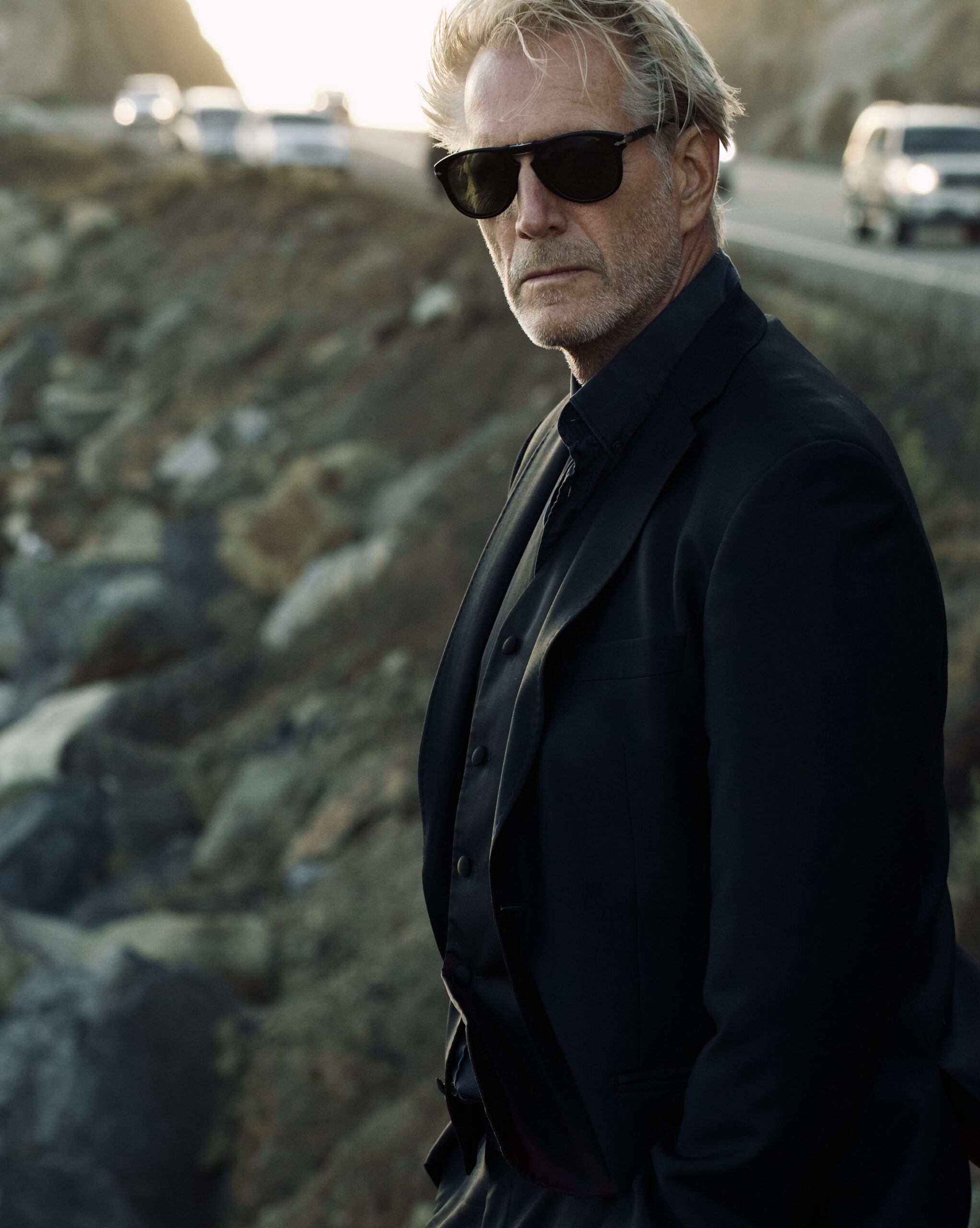 Hoyt Richards in sunglasses by the side of the highway