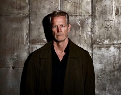 Hoyt Richards leaning against a metal wall