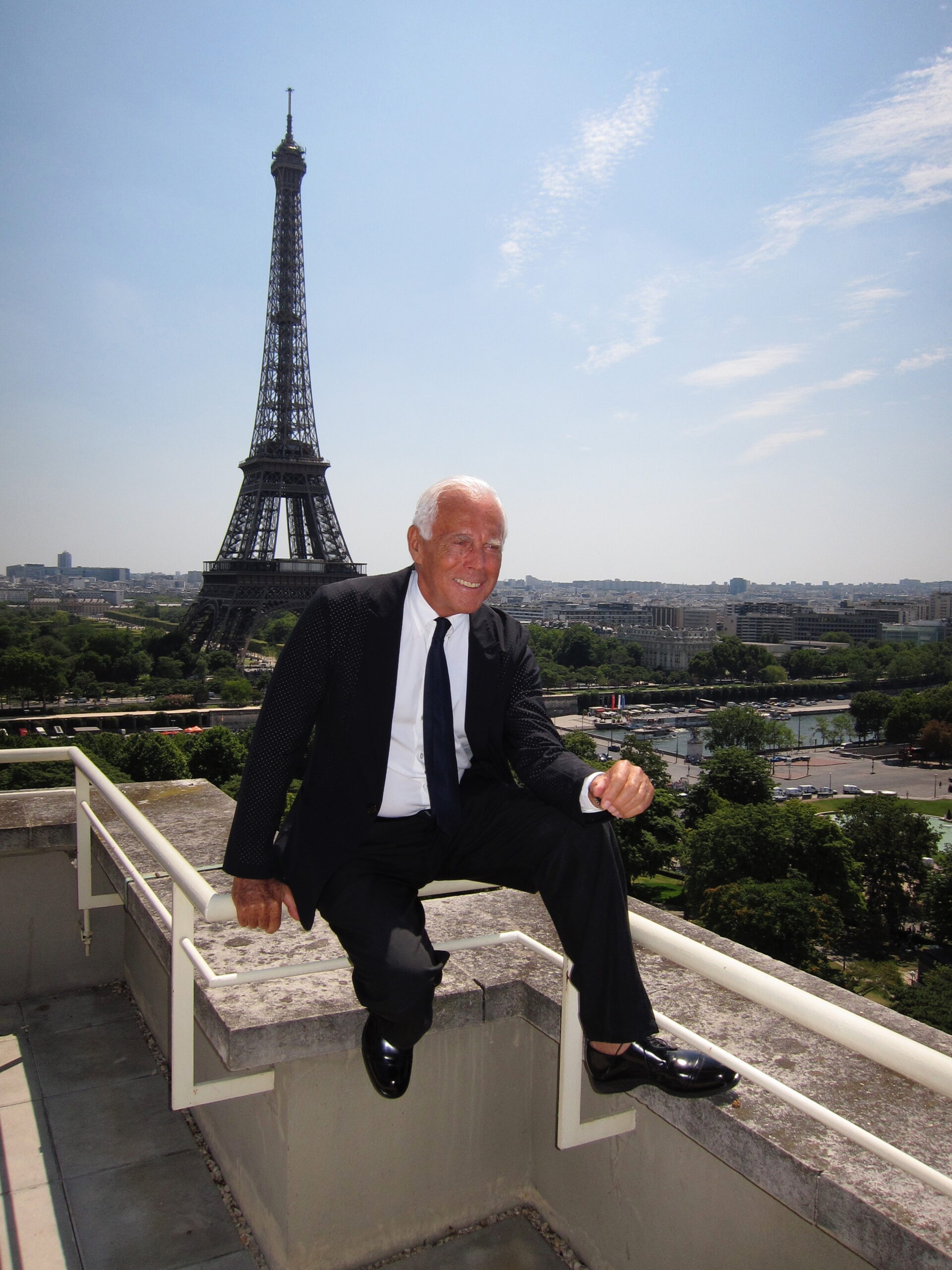 Giorgio Armani in front of the Eiffel Tower