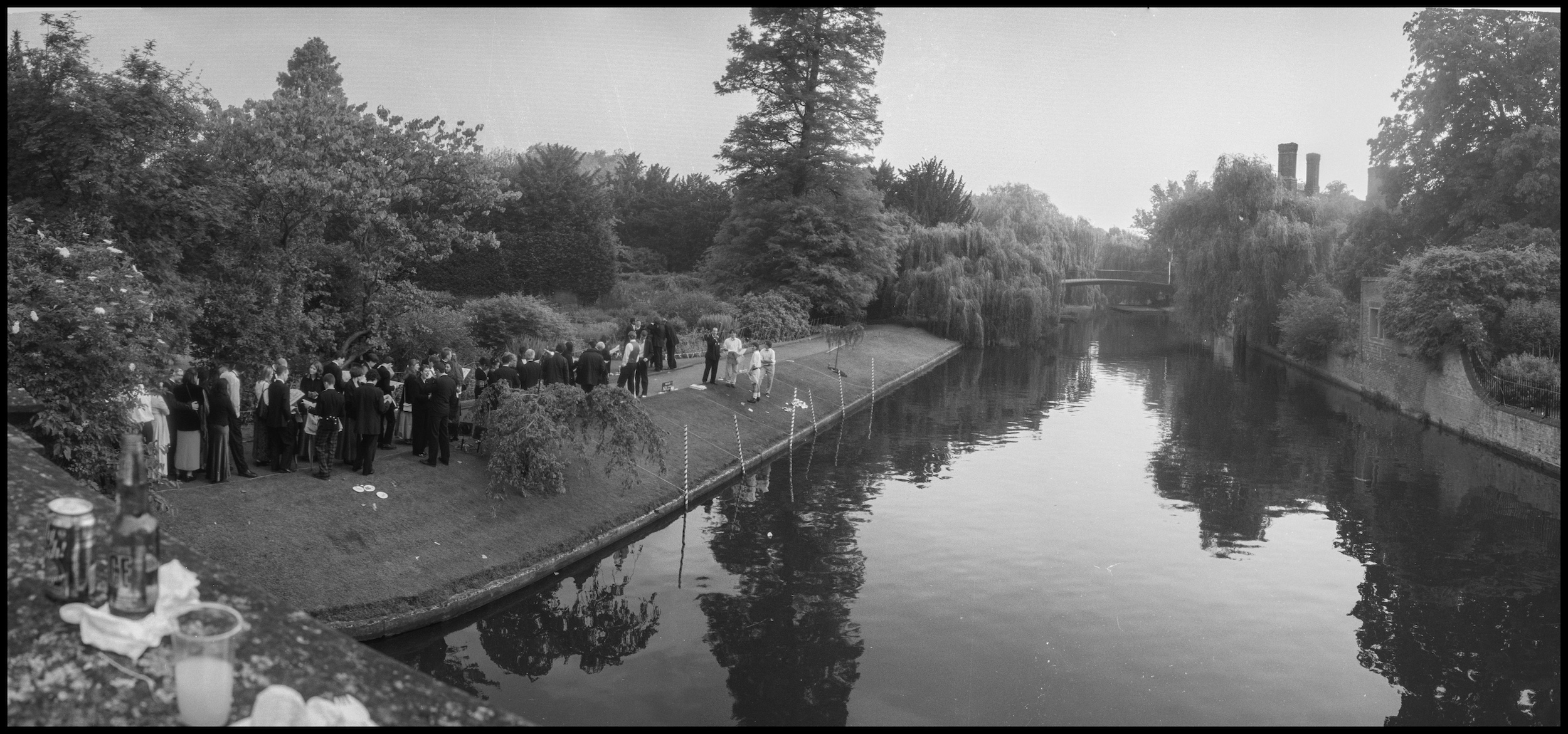 A scenic landscape showing the Cambridge May Ball next to a river.