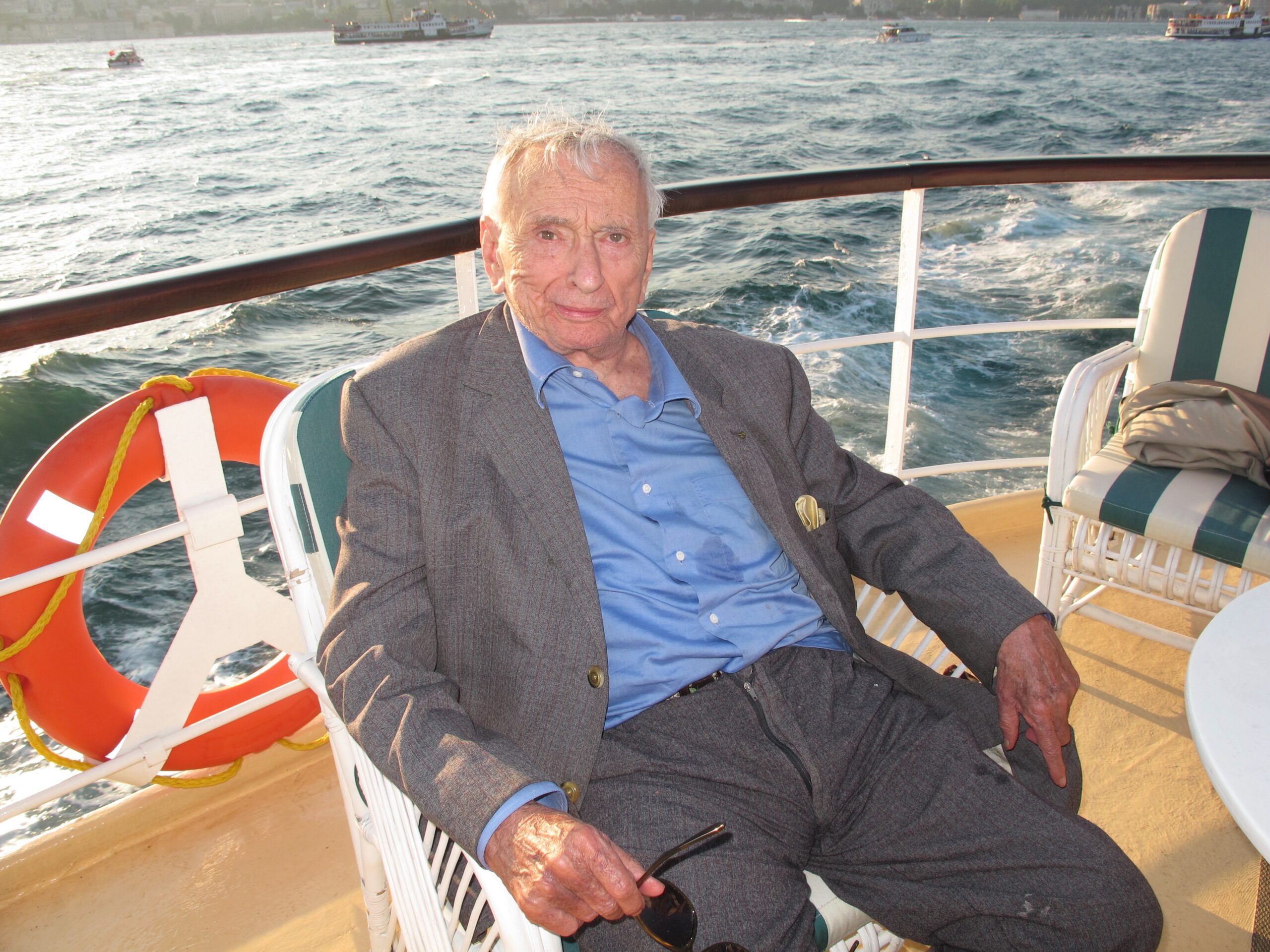Gore Vidal sitting on the deck of a boat
