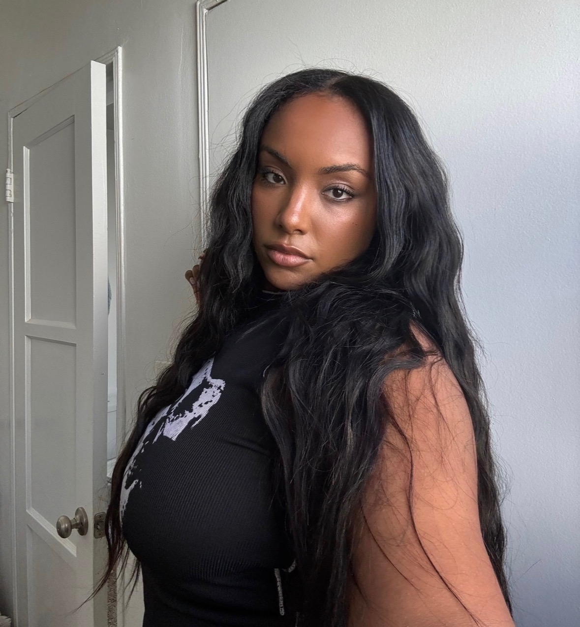 A selfie of Aida Osman wearing a black shirt