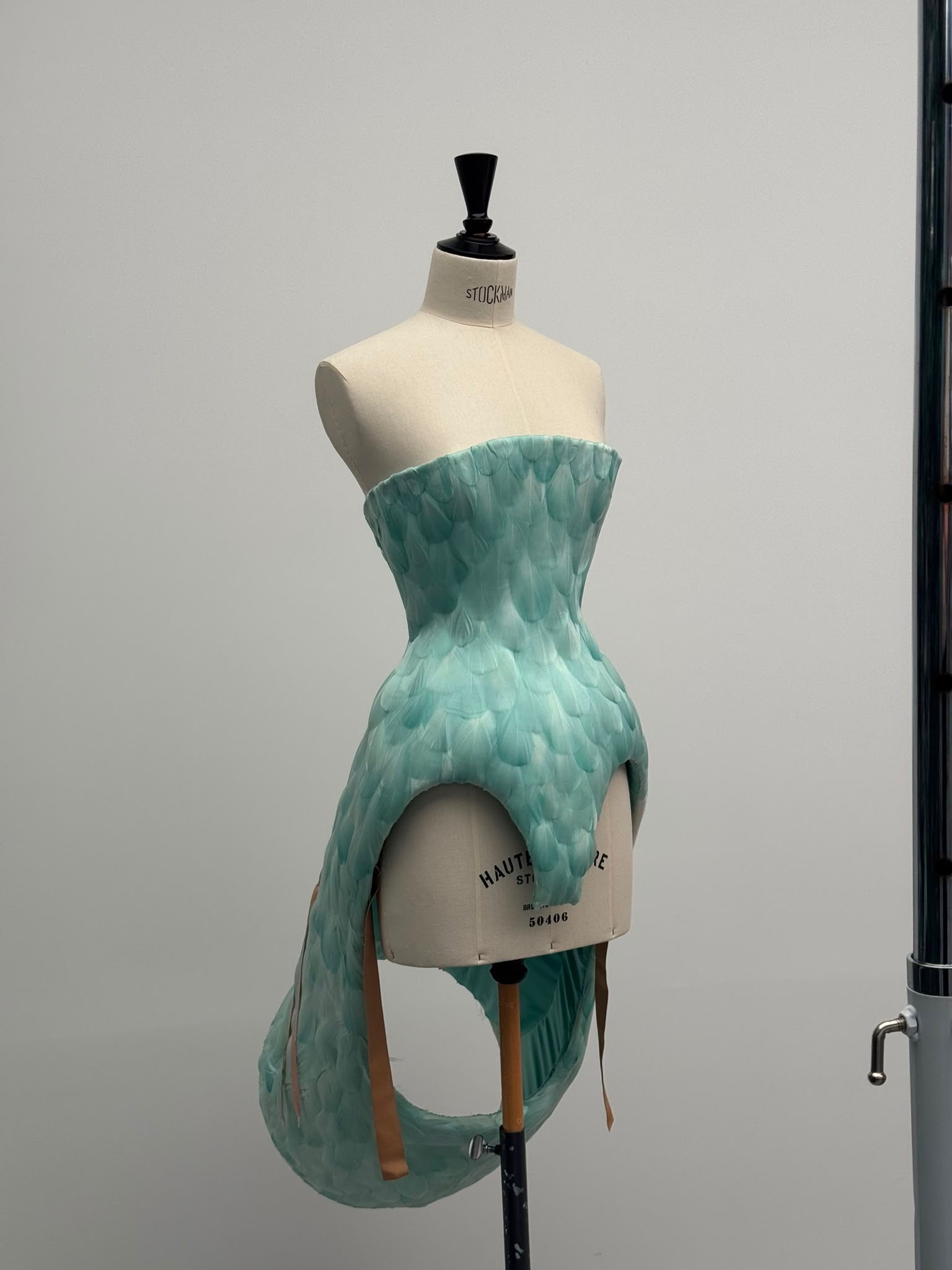 Feathery blue dress piece on a mannequin by Duran Lantink
