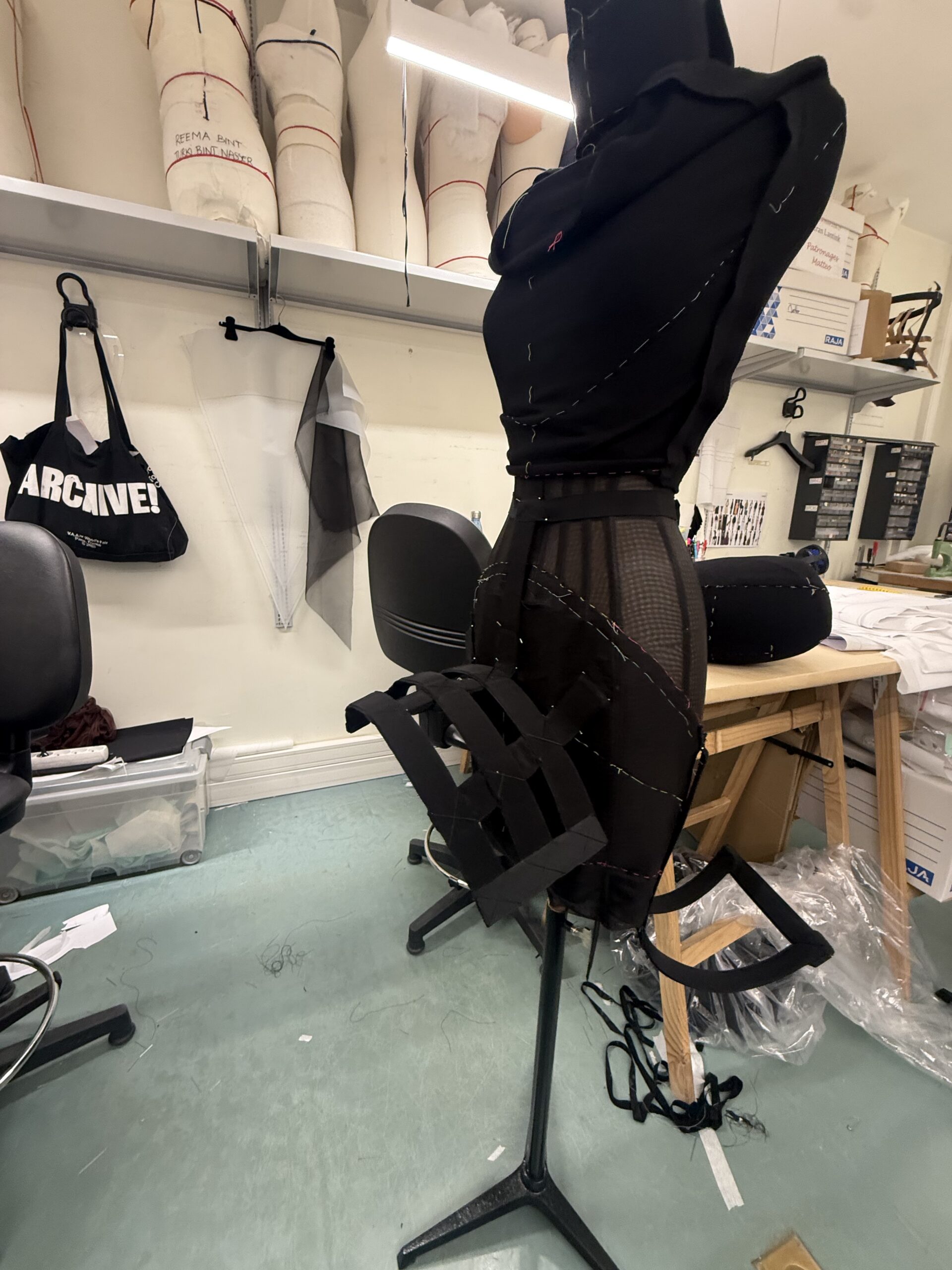 A black dress being made on a mannequin, designned by Duran Lantink