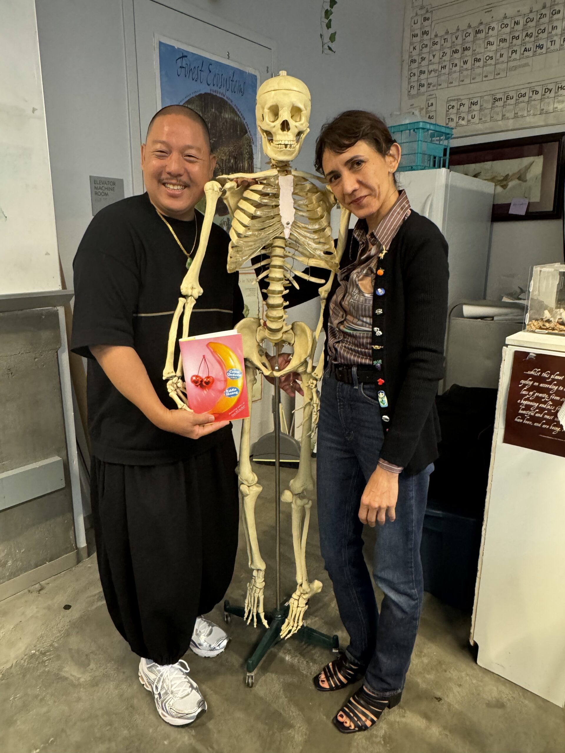 Eddie Huang and Ottessa Moshfegh pose with skeleton.