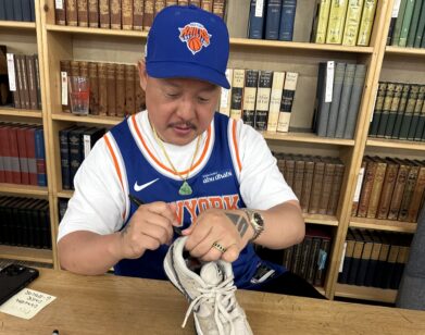Eddie Huang signing a sneaker at his book signing
